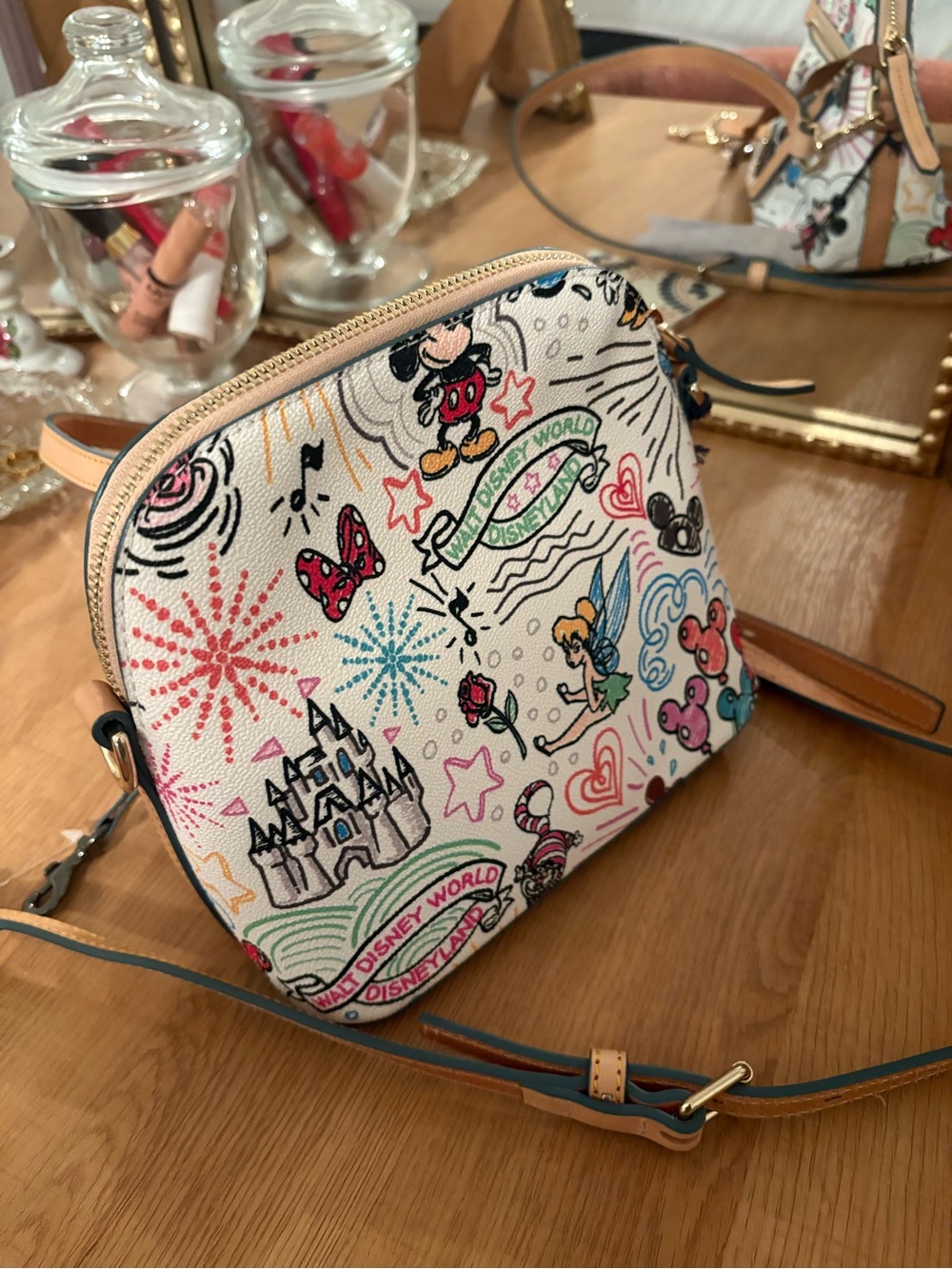 Dooney & Bourke White Canvas Disney Artwork Crossbody with Tan Leather Trim - Picture 2 of 3
